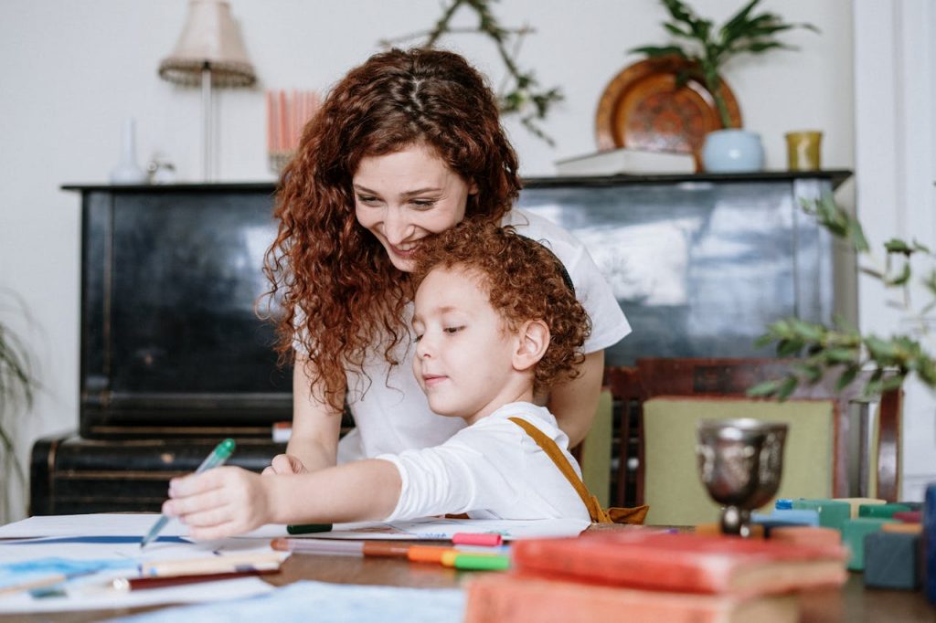 mother and son on a computer